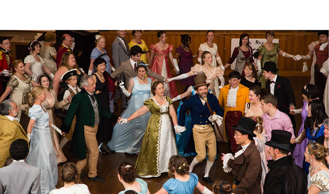 People dancing in historical clothing
